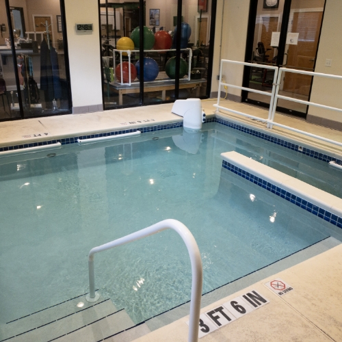 Spacious therapy area at Atlas Physical Therapy in Mandarin, Jacksonville, FL, equipped with treatment tables, rehabilitation equipment, and exercise stations.